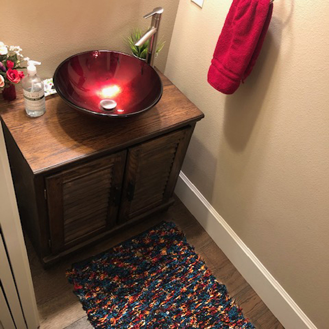 "Kathy's colorful rug goes perfectly in our guest bathroom. We get compliments on it all the time!" -Shirley B.